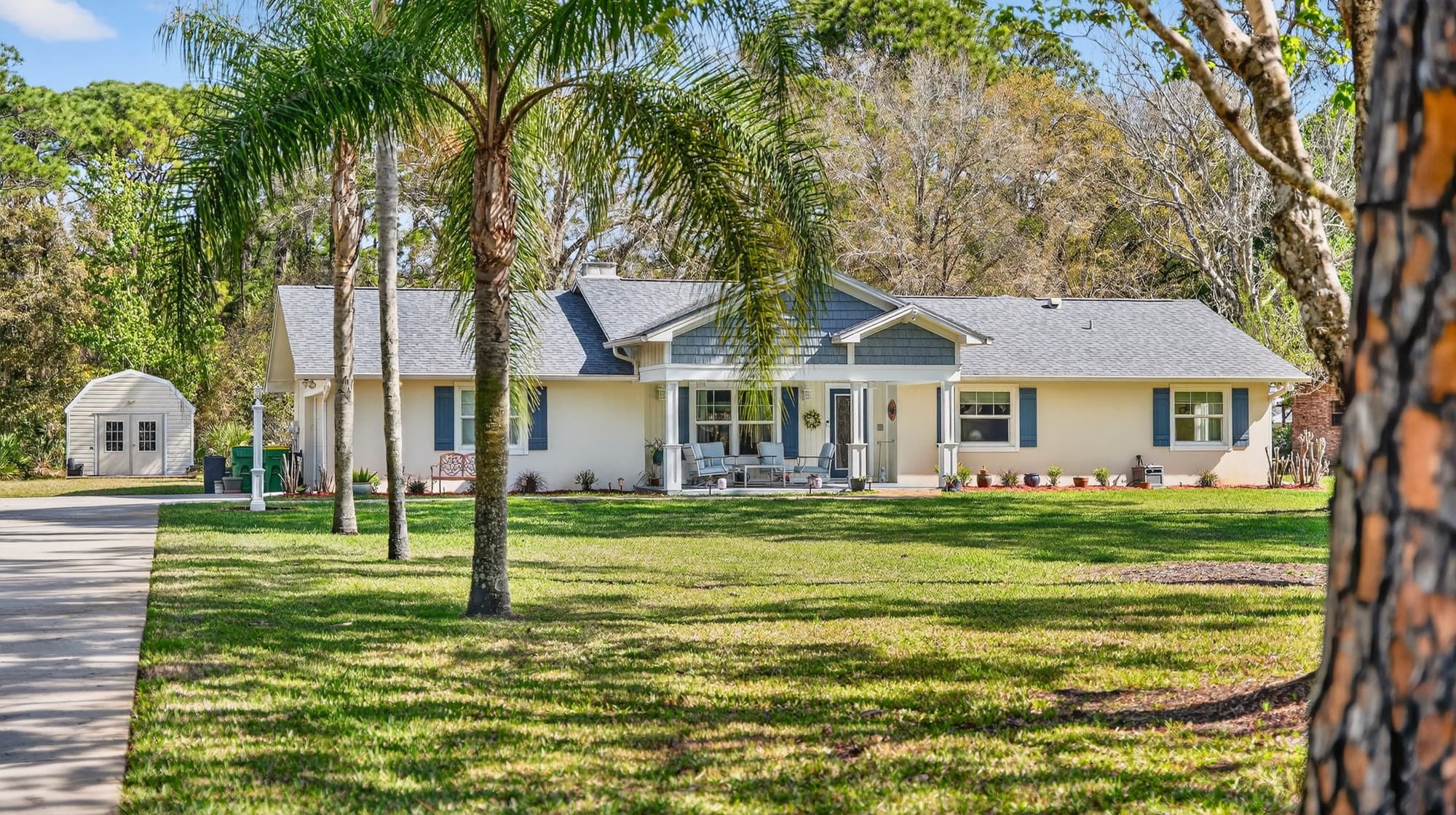 Modern home exterior on a manicured green lawn
