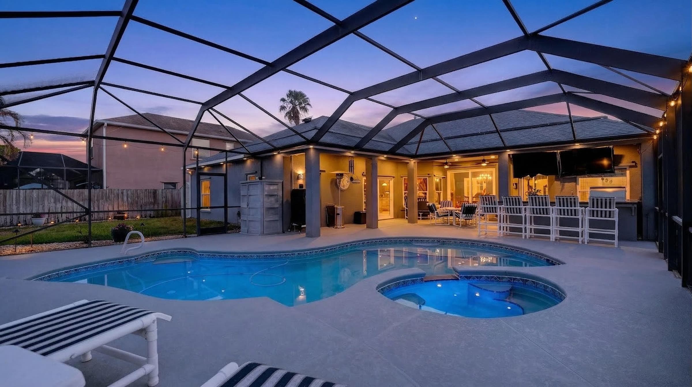 A twilight pool scene from a PMH listing — the kind of cinematic image Zillow Showcase was built for