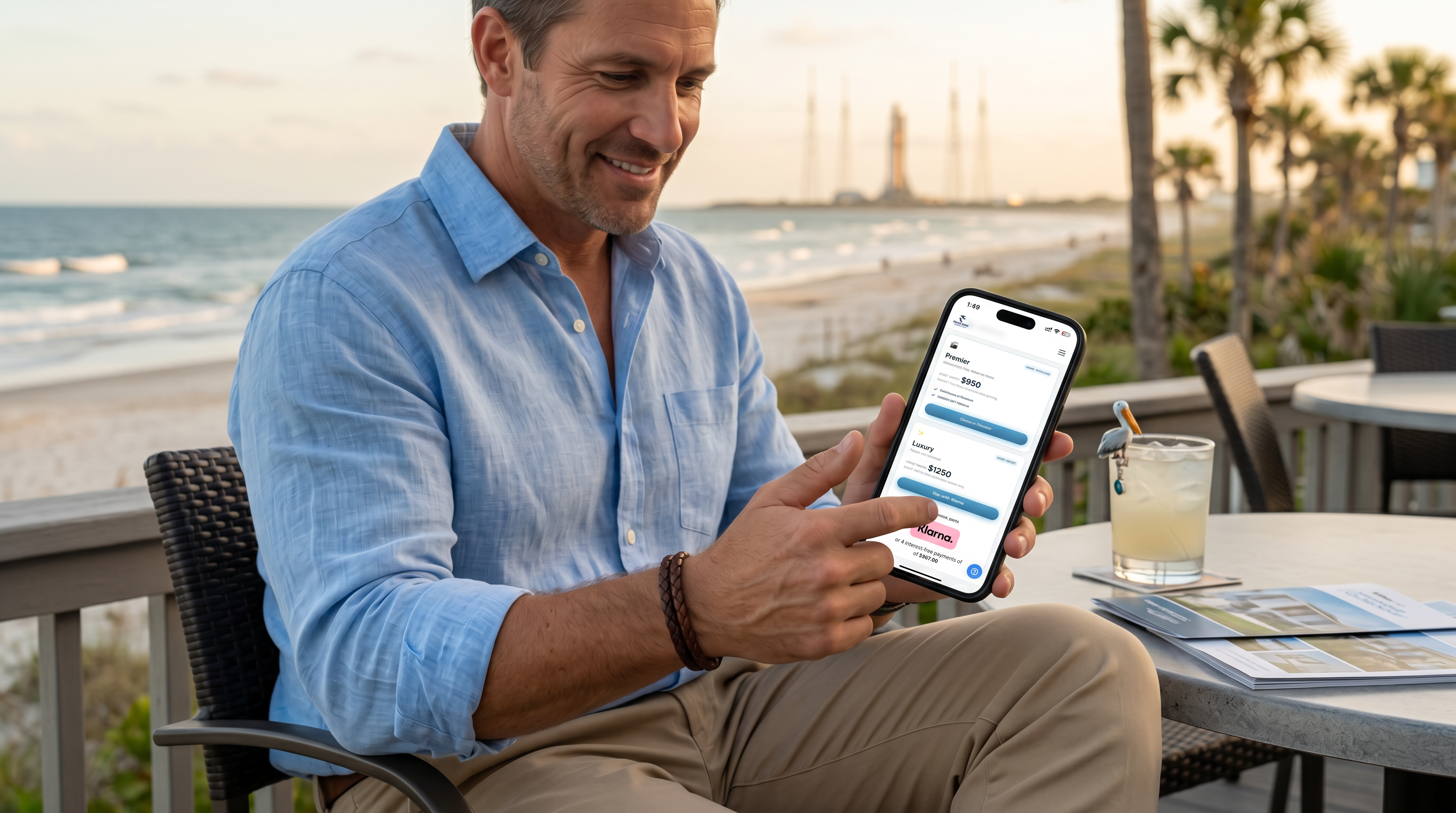 A Space Coast realtor reviewing Pelican Media Haus packages and Klarna financing on his phone, beach and Cape Canaveral launchpads in the background