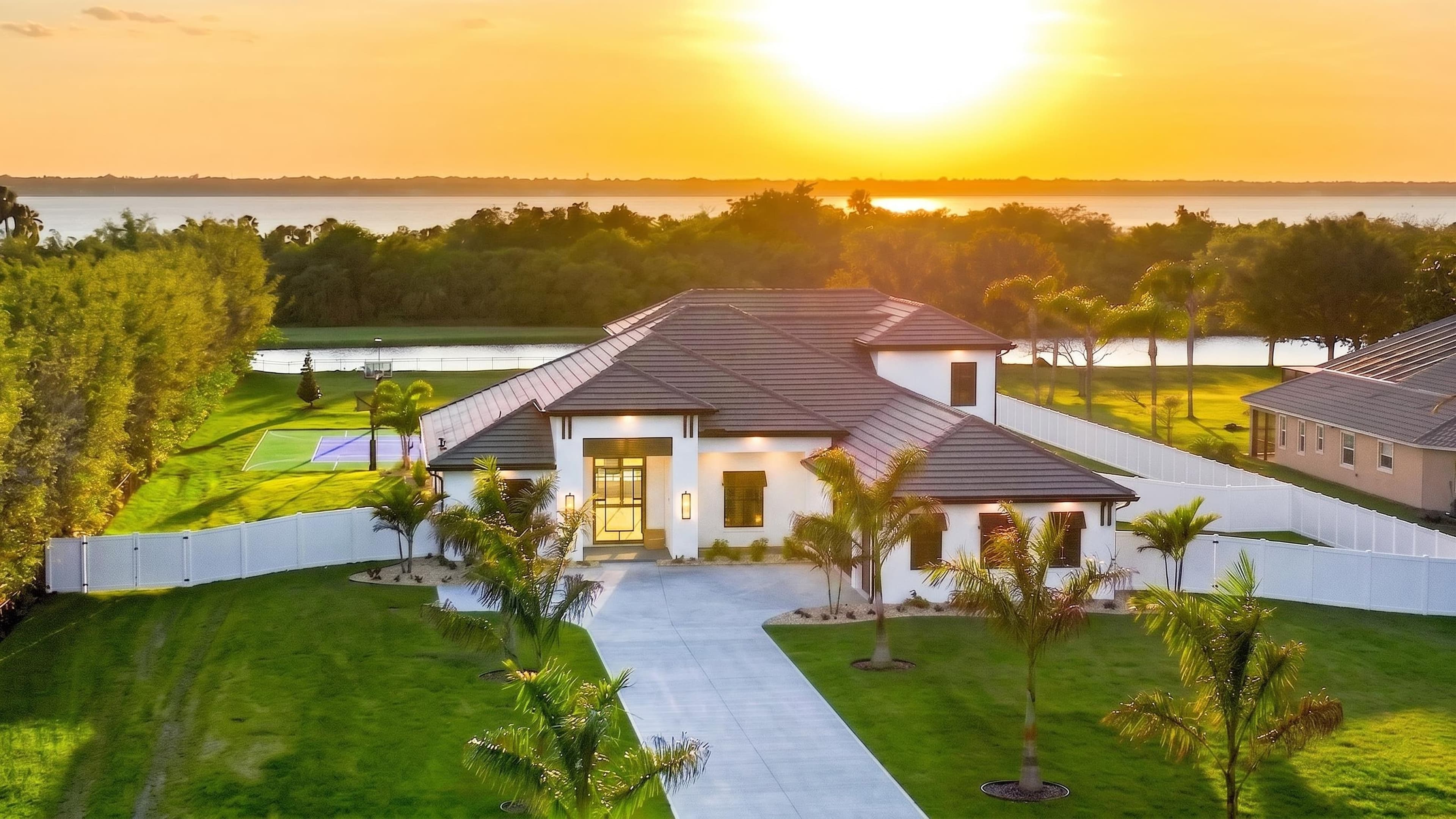 Aerial sunset shot of a lakefront property